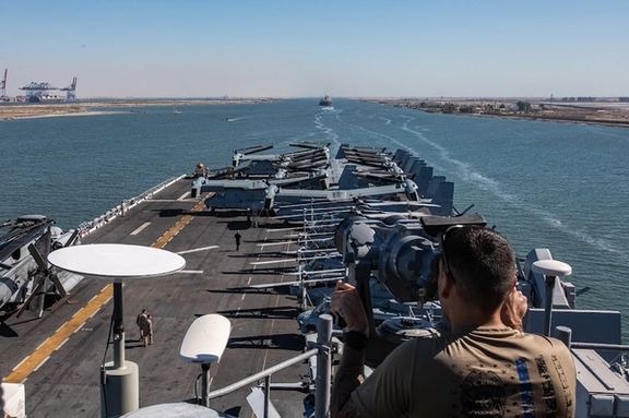 A US Navy sailor from USS Bataan (LHD 5) stands watch as the amphibious assault ship transits the Suez Canal with the 26th Marine Expeditionary Unit (MEU), August 6, 2023.