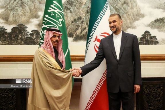 Iranian Foreign Minister Hossein Amirabdollahian (right) and his Saudi counterpart Faisal bin Farhan Al Saud