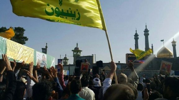 Photo shows a funeral procession of pro-Iran militia members killed in Syria, and buried in Qom, Iran. The flag of Zainabiyoun Brigade, which is made up of Pakistani nationals, is in the foreground May 25, 2017.