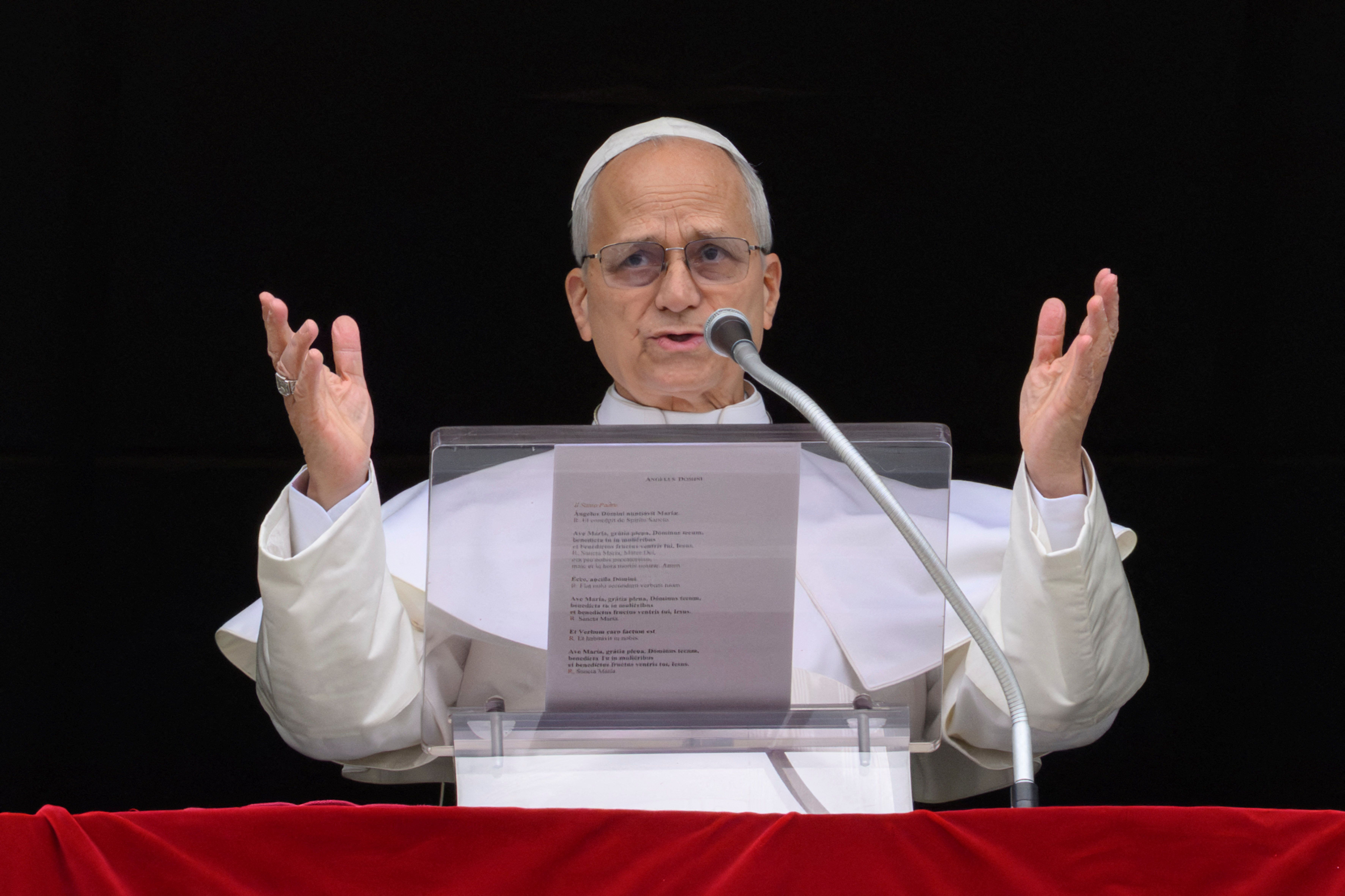 Pope Leo XIV leads the Angelus prayer from a window of the Apostolic Palace, at the Vatican, March 15, 2026. 