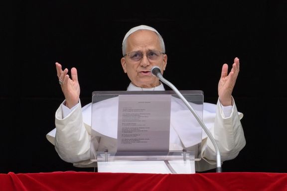 Pope Leo XIV leads the Angelus prayer from a window of the Apostolic Palace, at the Vatican, March 15, 2026.