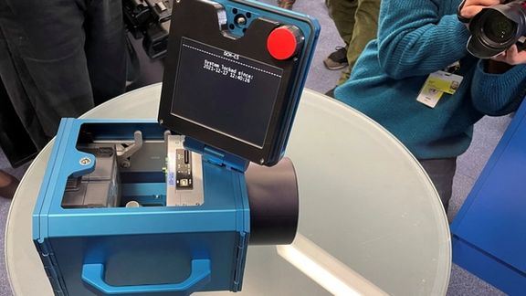 IAEA monitoring camera seen at a press conference in Vienna on December 17, 2021