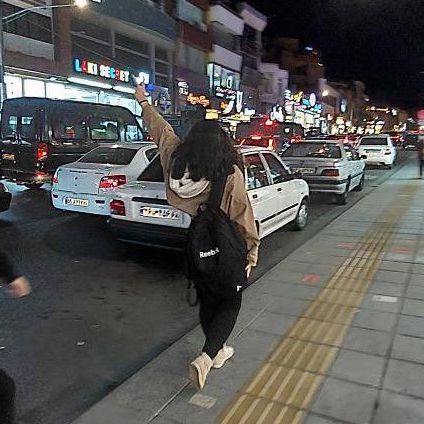 A girl who has unveiled in public in the city of Karaj, near capital Tehran