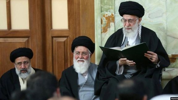 Ahmad Alamolhoda (center) with Iran’s ruler Ali Khamenei (right) and President Ebrahim Raisi in a ceremony