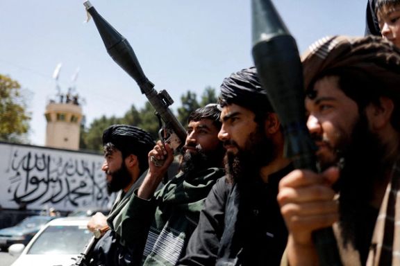 Taliban soldiers celebrate on the second anniversary of the fall of Kabul on a street near the US embassy in Kabul, Afghanistan, August 15, 2023.