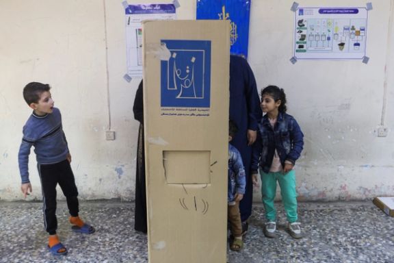 People vote in Iraq's provincial council elections at a polling station in Baghdad, Iraq, December 18, 2023.