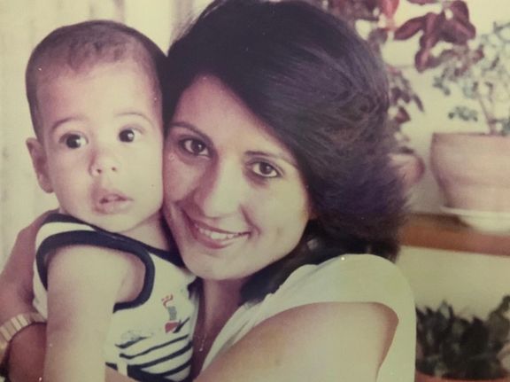 Itai Reuveni pictured as a baby with his mother Diana.