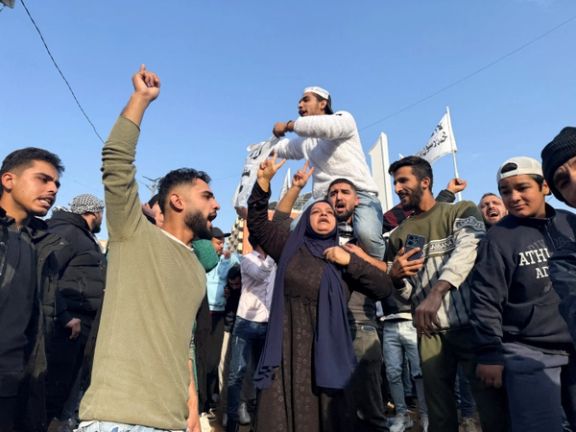 People gather as they celebrate, after Syrian rebels announced that they have ousted President Bashar al-Assad, in Tripoli, northern Lebanon December 8, 2024.