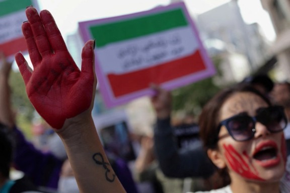 A demonstrator shouts slogans during a protest against the Islamic Republic, following the death of Mahsa Amini, near the Iranian consulate in Istanbul, Turkey October 11, 2022.