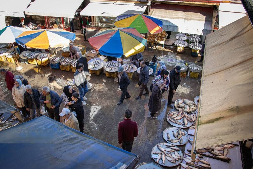 Shoppers stock up on essentials at a market in Rasht, northern Iran, on December 20, 2025.