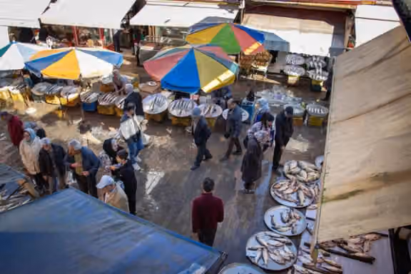 Shoppers stock up on essentials at a market in Rasht, northern Iran, on December 20, 2025.