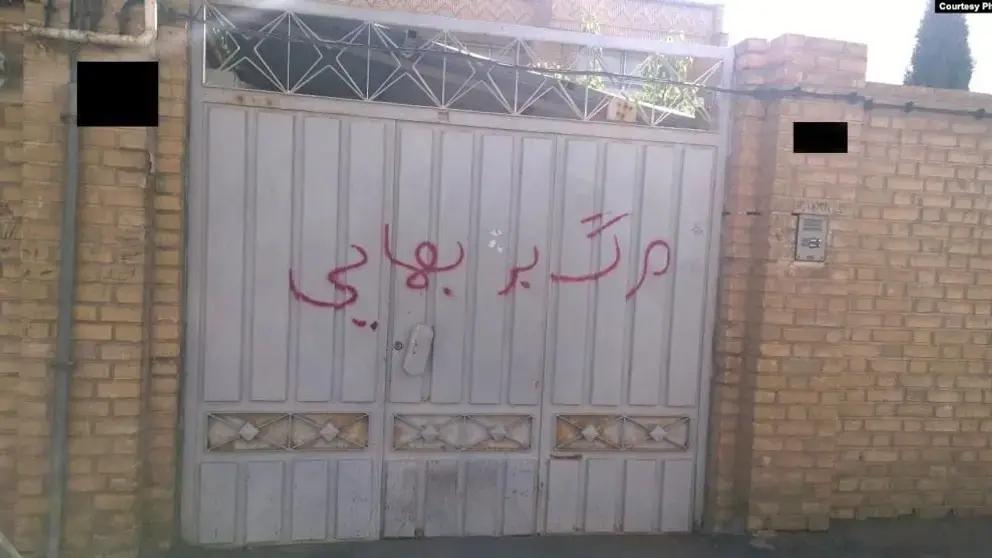 "Death to Baha'is" written on the gate of a house belonging to a Baha'i family