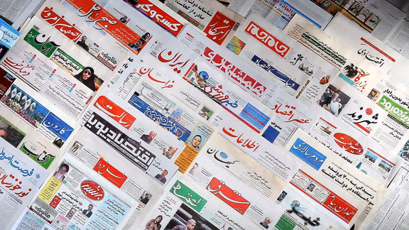 A number of newspapers at a kiosk in Tehran
