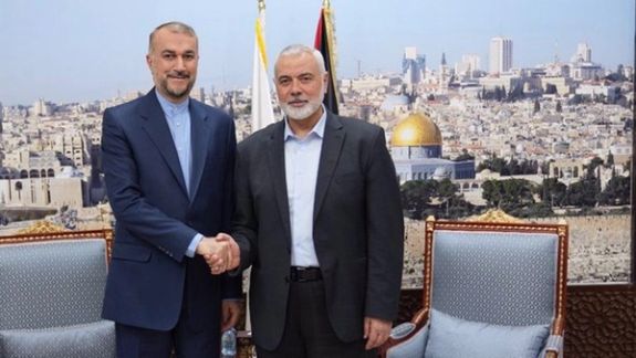 Iranian Foreign Minister Hossein Amir-Abdollahian (left) and Hamas leader Ismail Haniyeh in Doha, Qatar, on October 31, 2023