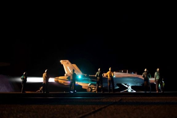 US crews prepare a warplane for airstrikes on Houthi targets on February 3, 2024
