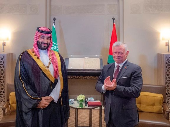 Jordan's King Abdullah ll presents a necklace to Saudi Crown Prince Mohammed bin Salman during his visit to Amman, Jordan, June 21, 2022.