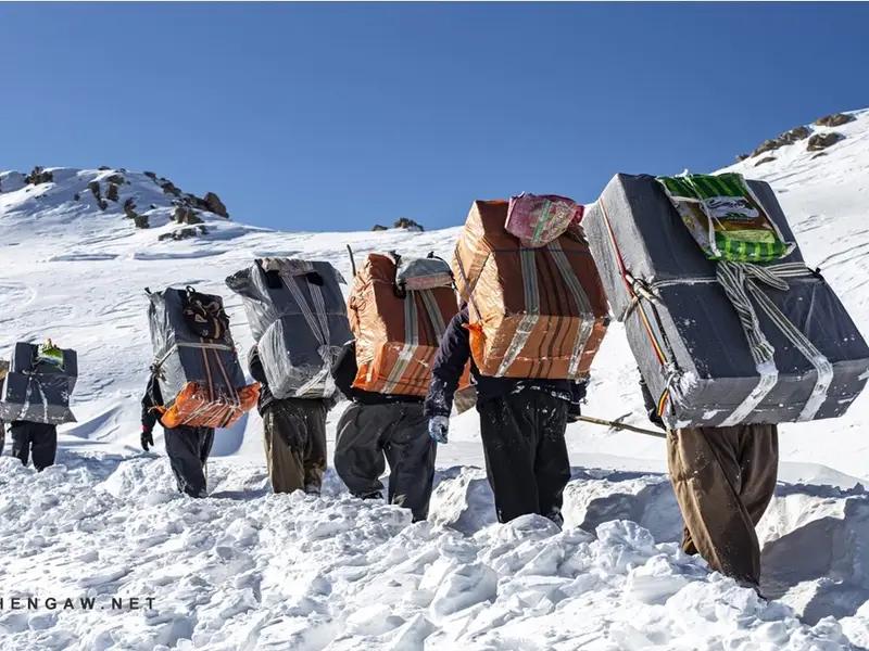 A group of Iranian cross-border porters, known as Kolbars
