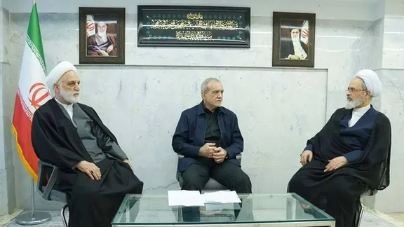 Members of Iran’s leadership council meet at an undisclosed location on March 1 with social media users saying the low ceiling and iron door behind them suggest the meeting was held inside Tehran’s Arman Hospital.