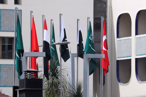 The national flags of Pakistan, Saudi Arabia, Turkey and Egypt stand hoisted outside the Ministry of Foreign Affairs office, on the day Pakistan hosts talks with Saudi Arabia, Turkey and Egypt to discuss regional de-escalation in Islamabad, Pakistan, March 29, 2026.