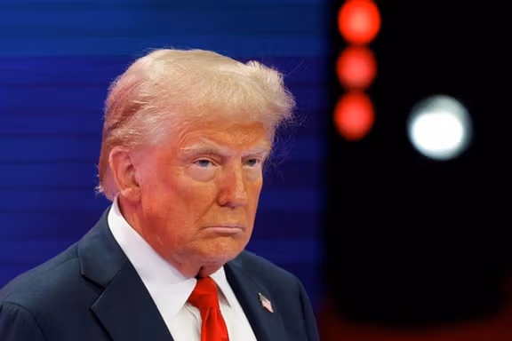 Trump suggests he would not seek Iran regime change