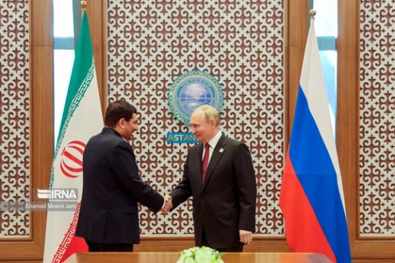 Russian president Vladimir Putin shaking hands with Iran's acting president Mohammad Mokhber July 4, 2024.