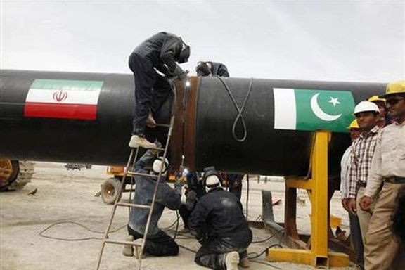 Iranian workers welding the pipeline during a groundbreaking ceremony to mark the inauguration of the Iran-Pakistan gas pipeline, in the city of Chabahar in southeastern Iran March 11, 2013