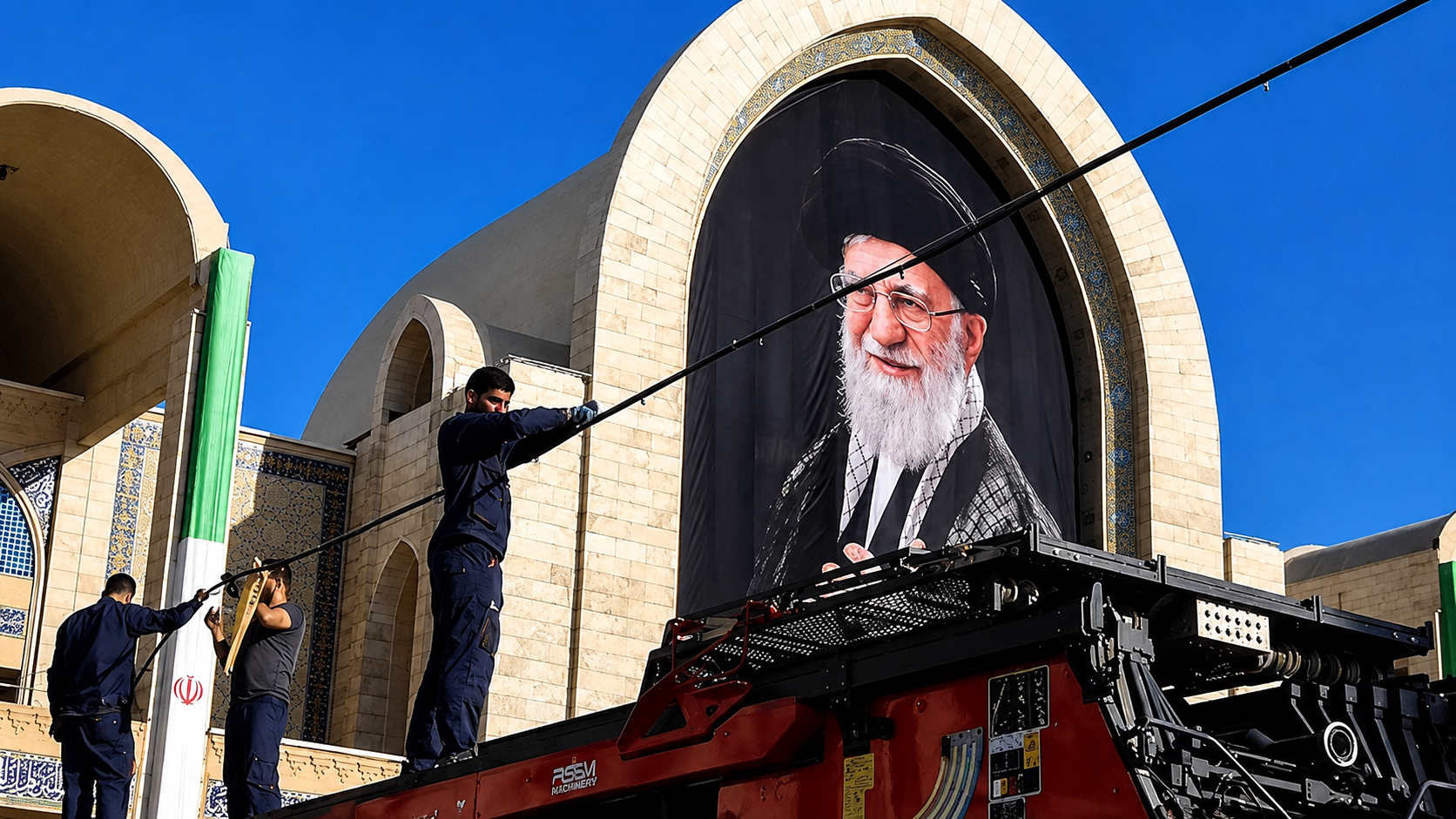 Workers arrange decorations during funeral preparations for Iran's former Supreme Leader Ali Khamenei.