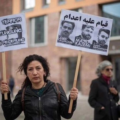 A protester against Iran’s execution of three political prisoners (May 20, 2023)