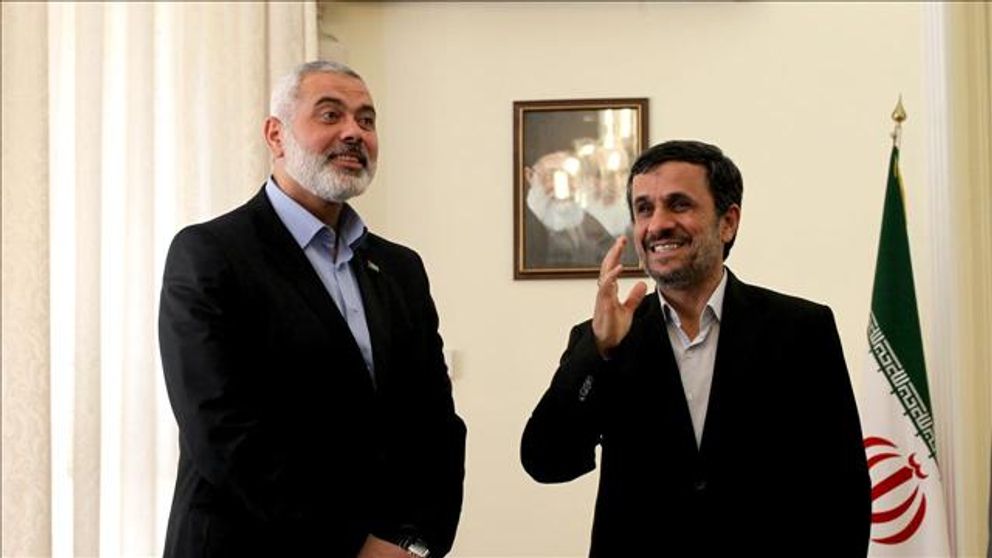 Iran’s former president Mahmoud Ahmadinejad (right) and Chairman of the Hamas Political Bureau Ismail Haniyeh in Tehran    