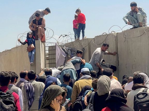 Afghans trying to flee after the Taliban takeover, in Kabul airport. August 16, 2021