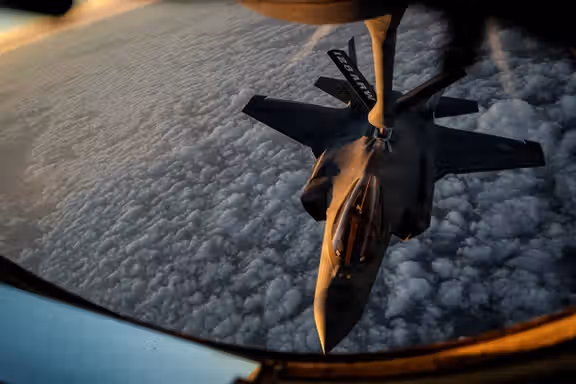 A US Air Force KC-135 Stratotanker aircraft refuels a US Air Force F-35A Lightning II aircraft during the Operation Epic Fury attack on Iran at an undisclosed location in the U.S. Central Command area of responsibility April 5, 2026.