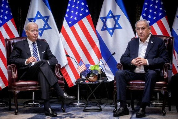 US President Joe Biden, left, pauses during a meeting with Israeli Prime Minister Benjamin Netanyahu, right, to discuss the war between Israel and Hamas, in Tel Aviv, Israel, Wednesday, Oct. 18, 2023.