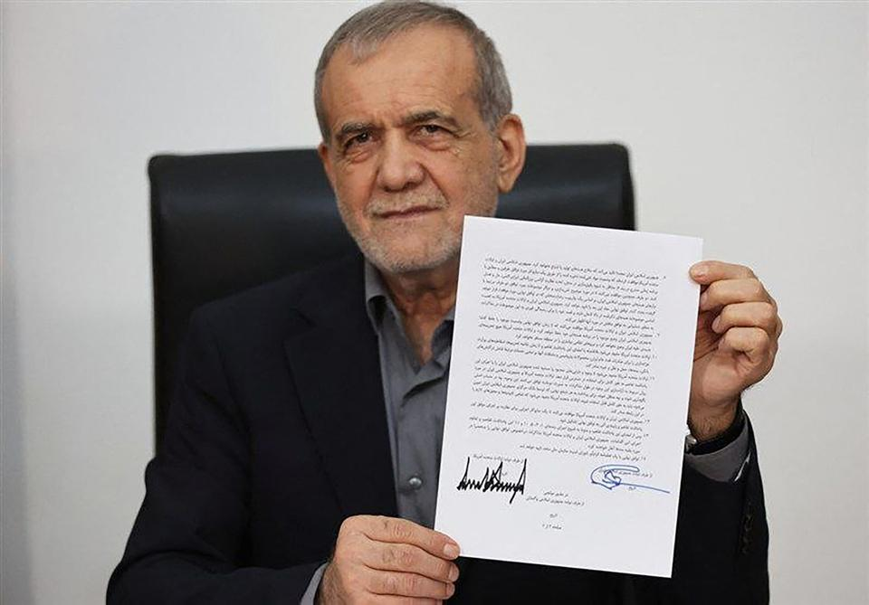 President Masoud Pezeshkian showing his copy of the MoU signed remotely with President Donald Trump. June 17, 2026