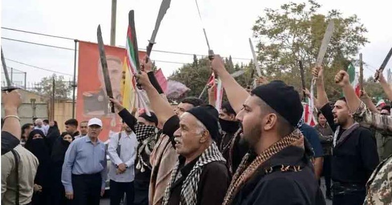 Machete-wielding men at IRGC-backed rally revive scrutiny of crackdowns