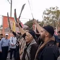 Machete-wielding men at IRGC-backed rally revive scrutiny of crackdowns