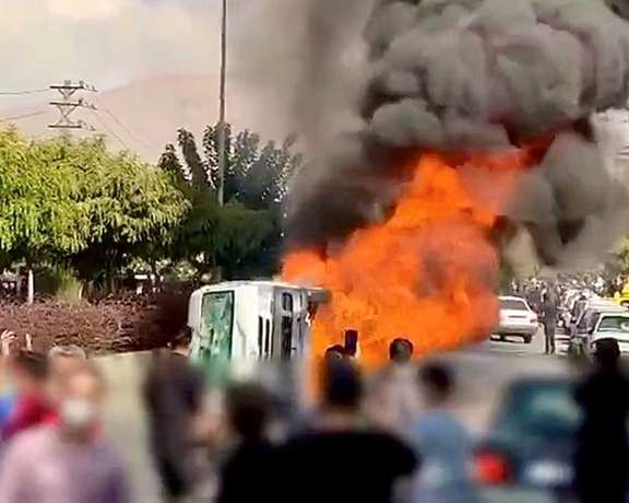 A large protest in Karaj, near Tehran on November 3 turned violent, with a police car attacked and torched