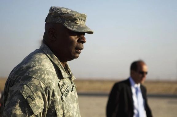US Secretary of Defense Lloyd Austin, then commander of the US forces in Iraq, greets the last group of soldiers from the 3rd Brigade Combat Team, 1st Cavalry Division to cross the Kuwaiti border as part of the last US military convoy to leave Iraq. (December 18, 2011)