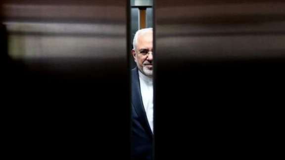 Former Foreign Minister Mohammad Javad Zarif behind the doors of an elevator