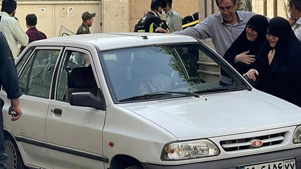 Family members of Colonel Hassan Sayyad-Khodayari, a member of the Quds Force of Iran’s Revolutionary Guards, cry over his dead body at his car outside his home on May 22, 2022.  