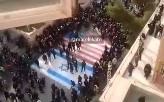 University students in Tehran refusing to walk on the American and Israeli flags. January 2020