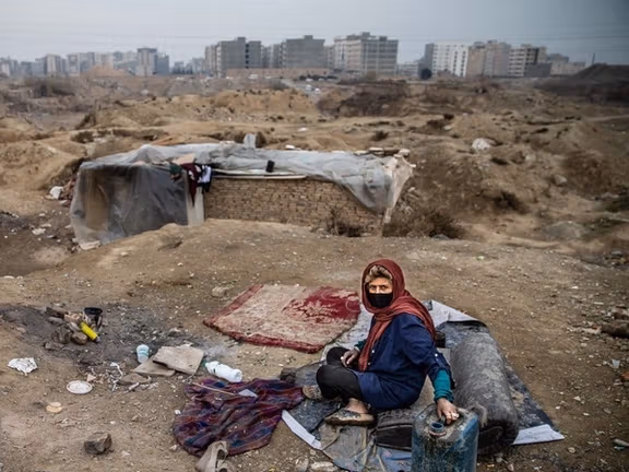 A poor woman living on the outskirts of Tehran without shelter