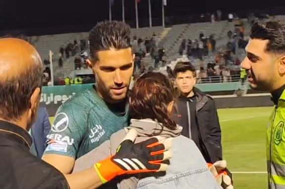 Controversy Erupts As Female Fan Hugs Goalkeeper In Iran