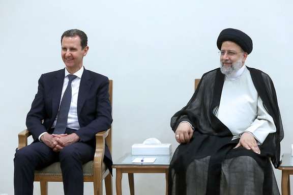 Syrian President Bashar Assad (left) and his Iranian counterpart Ebrahim Raisi during a meeting in Tehran on May 8, 2022