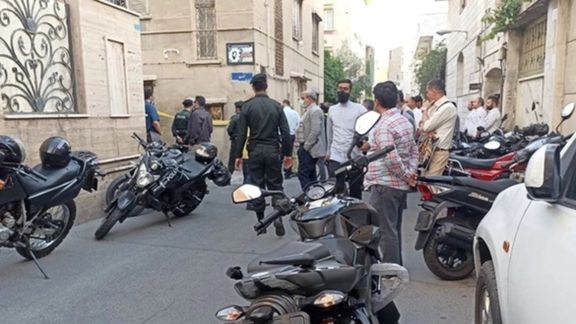 Agents and onlookers gathered around Khodaei's house on Sunday