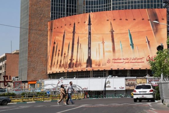 An anti-Israel billboard with a picture of Iranian missiles is seen on a street in Tehran, Iran April 19, 2024.