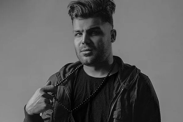 Dissident Iranian rapper sentenced to death arrives in Germany