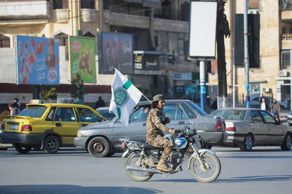 Syrian opposition fighter drives a motorbike in Aleppo, after the Syrian army said that dozens of its soldiers had been killed in a major attack by rebels who swept into the city, in Syria November 30, 2024.
