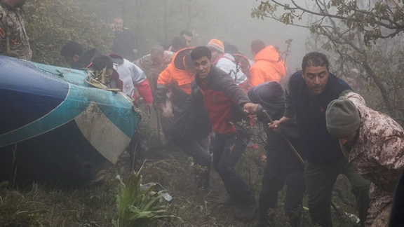 Rescue team members works following at the scene. of a crash of the helicopter carrying Iran's President Ebrahim Raisi, in Varzaqan, East Azerbaijan Province, Iran, May 20. via WANA
