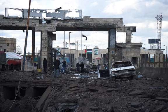 People inspect the damage at the Lebanese-Syrian border crossing of Arida after it was damaged following an Israeli strike that occurred late on Tuesday, Lebanon November 27, 2024.