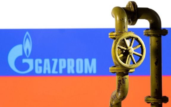 A 3D printed natural gas pipeline is placed in front of displayed Gazprom logo and Russian flag in this illustration taken February 8, 2022.